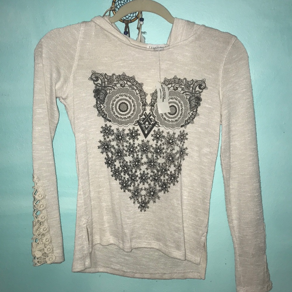 Sweater with owl detail and hood on back.